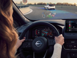 Reverse image of a woman driving a Nissan Qashqai e-POWER