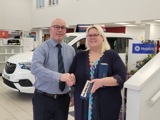 Zoe receiving her 25 year award from Steve Baker